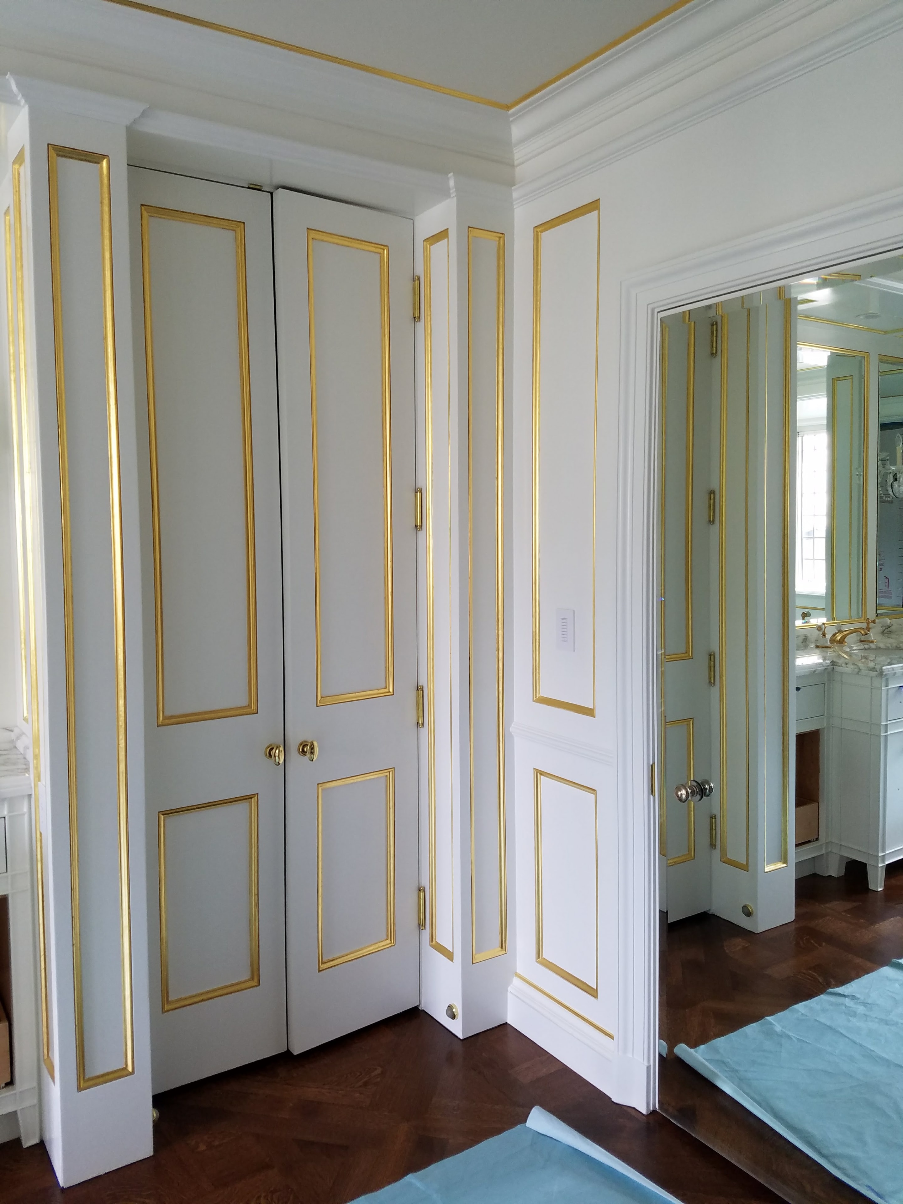 Gold leaf entry doors and millwork